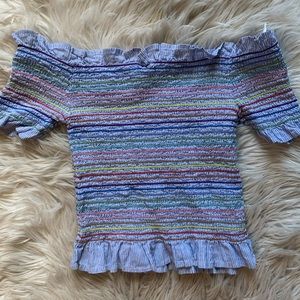 An off the shoulder colorful top